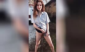 Redhead Pulls Down Her Black Underwear and Pisses Outside