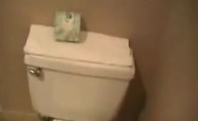 Fat lady peeing over toilet