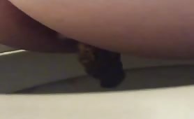 Chubby babe shitting in toilet