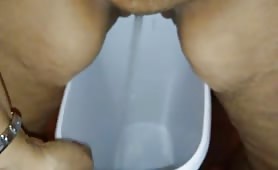 BBW babe peeing in a bucket