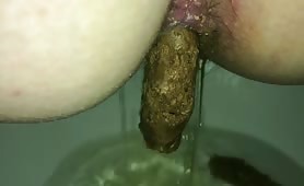 Long brown turd from a tight ass