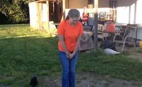 She's peeing in the garden