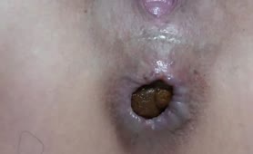 Close up of sweet babe shitting on bedroom floor