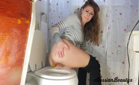 Hairy babe shits over toilet
