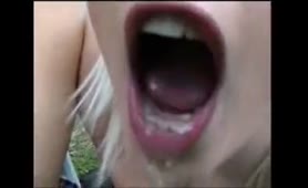 Blonde babe decides to pee in a glass outdoor