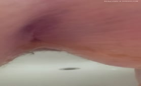 Shaved babe shitting in close up