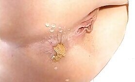 Nice young babe poops in closeup