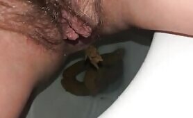 Hairy mature milf masturbates and poo