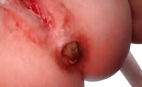 Young blonde's constipated poop closeup 