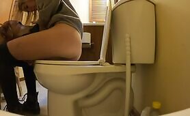 Amateur brunette girl shitting in the toilet 