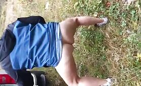 Lady pee all over the grass