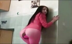 Pretty brunette pooing in pantyhose