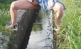 Pretty girl peeing in streams