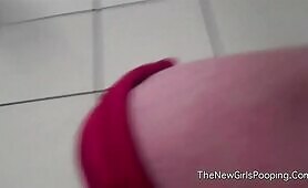 Woman shits in public bathroom