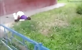 Curvy woman shits on ground with pants down