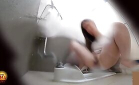 Japanese woman squats in bathroom and shits while pissing