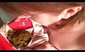 Nude Redhead Eats Shit from a Red Plate on Bed