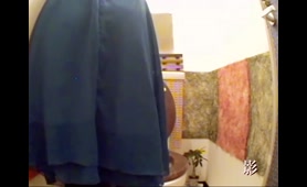 Shaved Babe Squats Over Toilet and Pisses While Shitting